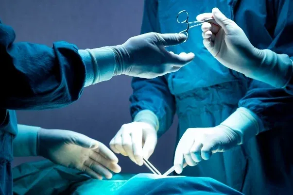 Surgical team performing orthopedic surgery