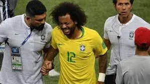 Player being helped by teammates after a lumbar spasm